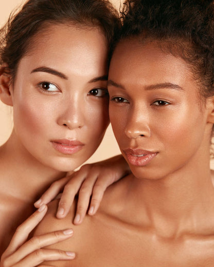 Two models showcasing radiant, flawless skin achieved with the Flawless Complexion Kit White by Shopify.