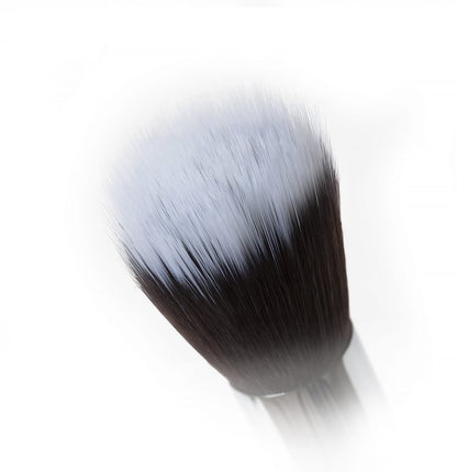 Close-up view of a high-quality Stippling Brush with vegan-approved synthetic Taklon bristles, featuring a flat top round head for flawless makeup application.