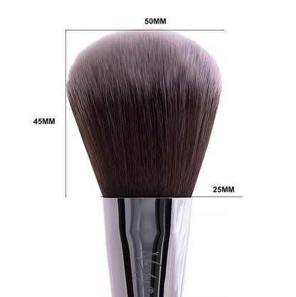 Close-up of a large, dome-shaped powder brush with soft synthetic bristles and a sleek pearl-coated handle.